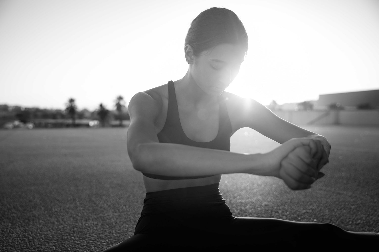 Woman stretching after workout, supporting her joints and muscles with natural collagen and magnesium supplements for optimal recovery and overall wellness.